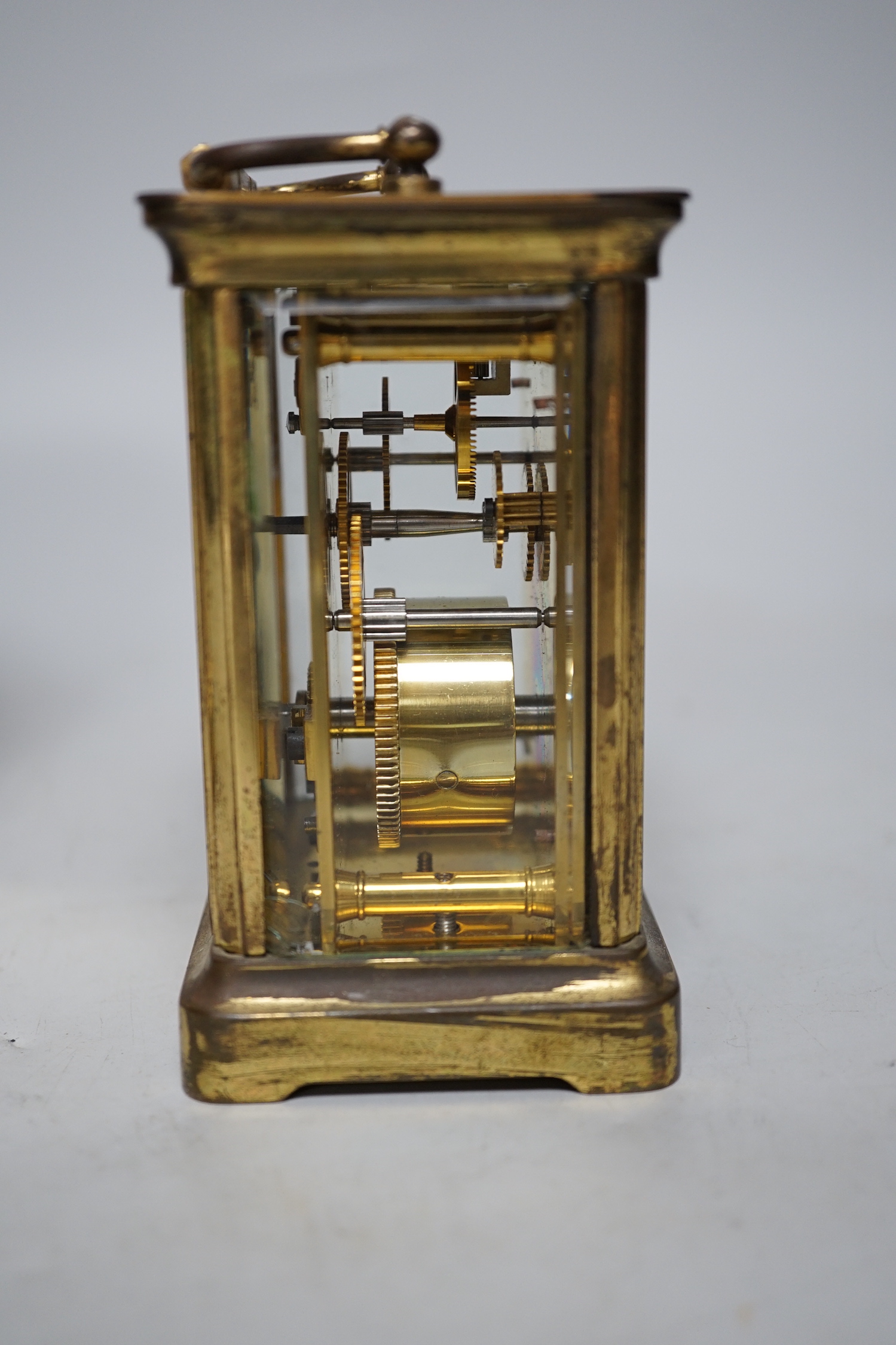 Two carriage timepieces comprising a brass example and one green onyx mounted with quartz movement, largest 17cm high